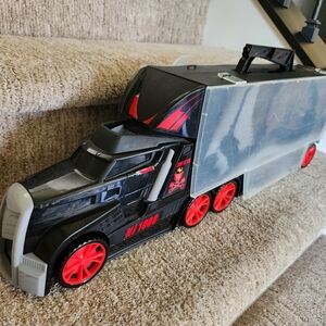 Black and Red Toy Truck with Trailer